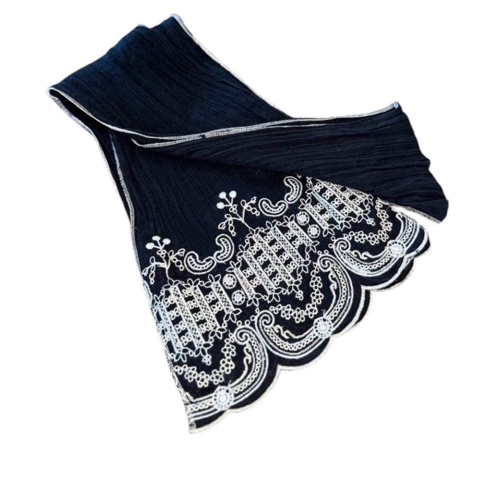 Vintage black scarf featuring intricate white embroidered scalloped ends